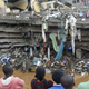 Residents watch rescue efforts at the site of a building collapse in Nairobi.